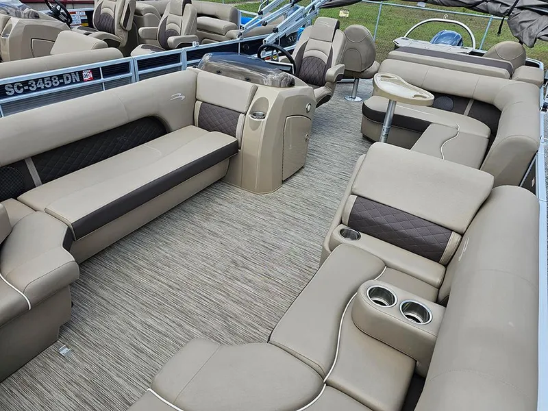 Slide: The Image of 2020 Bennington 22 SSXP pontoon boat interior with beige seating and modern design. - 8