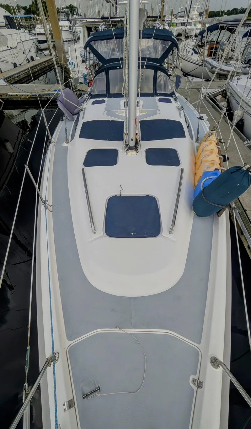Slide: The Image of Sailboat deck of 2001 Hunter 380, docked in marina, top view. - 5