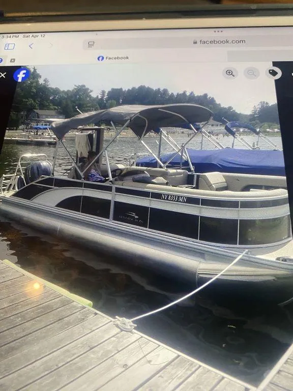 Slide: The Image of 2019 Bennington 23 SSBX pontoon boat docked on a sunny day. - 8