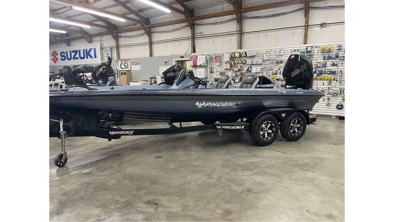 Slide: The Image of 2025 Phoenix 721 ZXL boat in showroom, featuring sleek design and dual motors. - 3