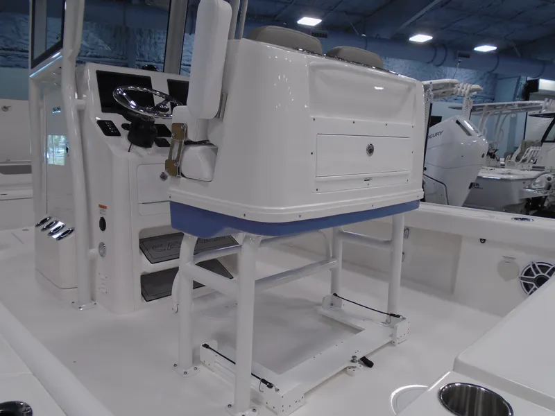 Slide: The Image of 2026 Caymas 26 HB boat interior with white seating and sleek design. - 14