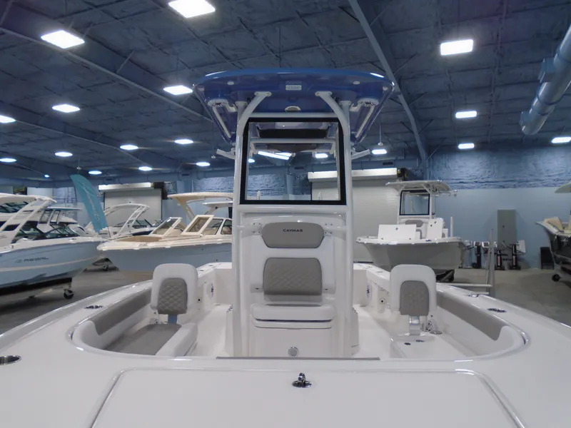 Slide: The Image of 2026 Caymas 26 HB boat console with steering wheel and controls. - 17