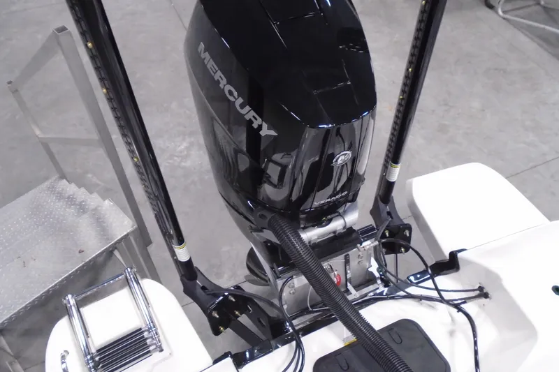 Slide: The Image of 2026 Caymas 26 HB boat with Mercury outboard motor, viewed from above. - 18