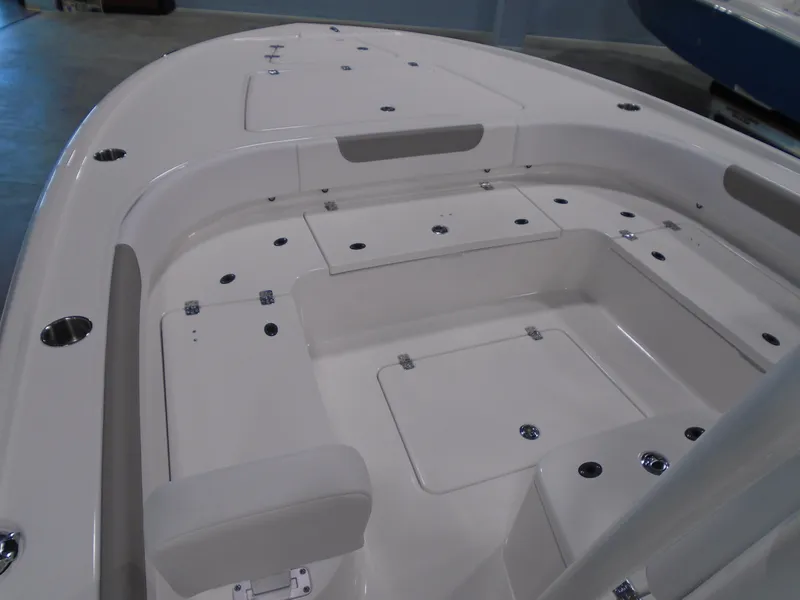 Slide: The Image of 2026 Caymas 26 HB boat on trailer, parked outdoors, side view. - 4