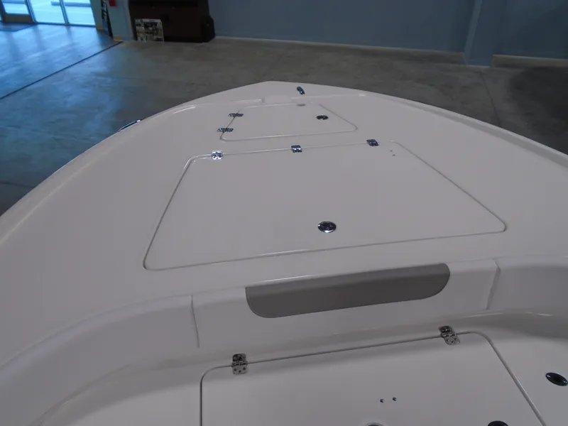 Slide: The Image of 2026 Caymas 26 HB boat interior with steering console and seating. - 6