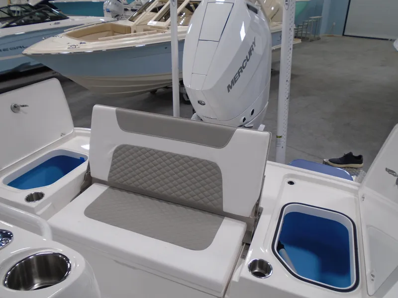 Slide: The Image of Interior view of 2025 Caymas 26 HB boat compartment with control panel and storage. - 9