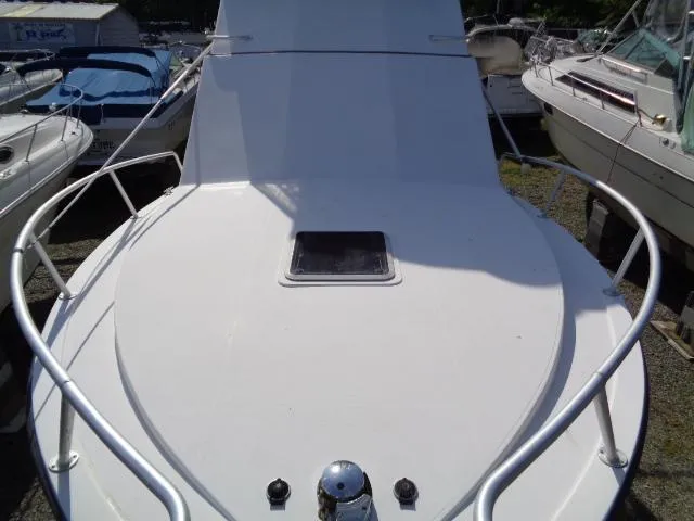 Slide: The Image of 1999 Albemarle 325 Convertible boat deck with railing and hatch. - 10