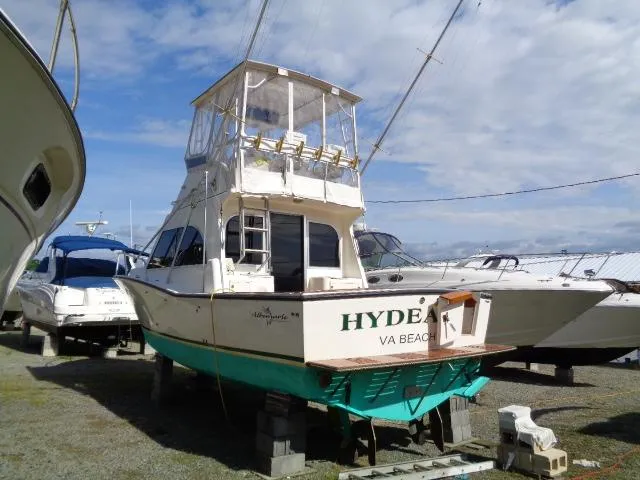 Slide: The Image of 1999 Albemarle 325 Convertible boat on dry dock, Virginia Beach. - 3