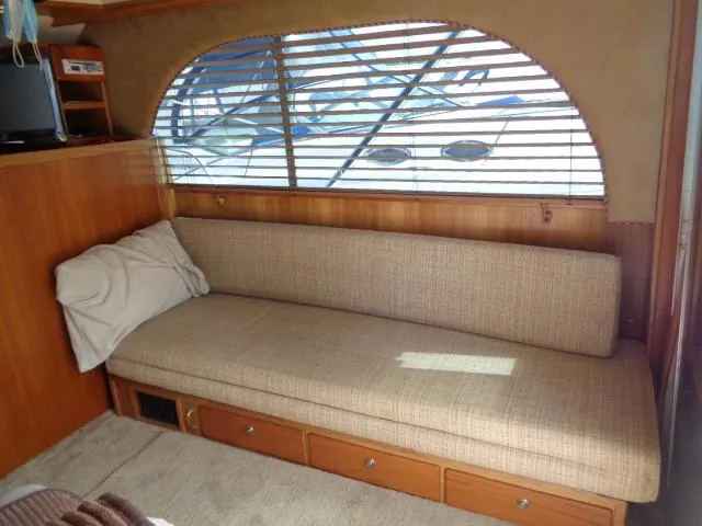 Slide: The Image of Interior of 1999 Albemarle 325 Convertible with beige sofa and window blinds. - 33