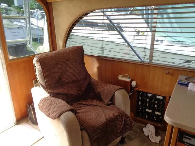 Slide: The Image of Interior of 1999 Albemarle 325 Convertible with cozy armchair and window view. - 34