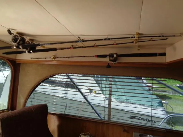 Slide: The Image of Interior of 1999 Albemarle 325 Convertible with fishing rods mounted on ceiling. - 36