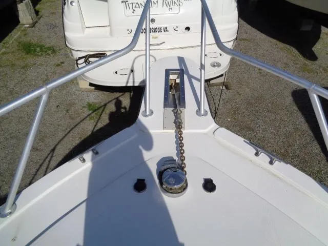 Slide: The Image of Bow of 1999 Albemarle 325 Convertible boat with anchor chain and railing. - 9