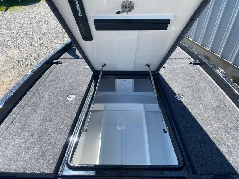 Slide: The Image of Open storage compartment of 2025 Phoenix 721 ZXL boat, showcasing spacious interior. - 16
