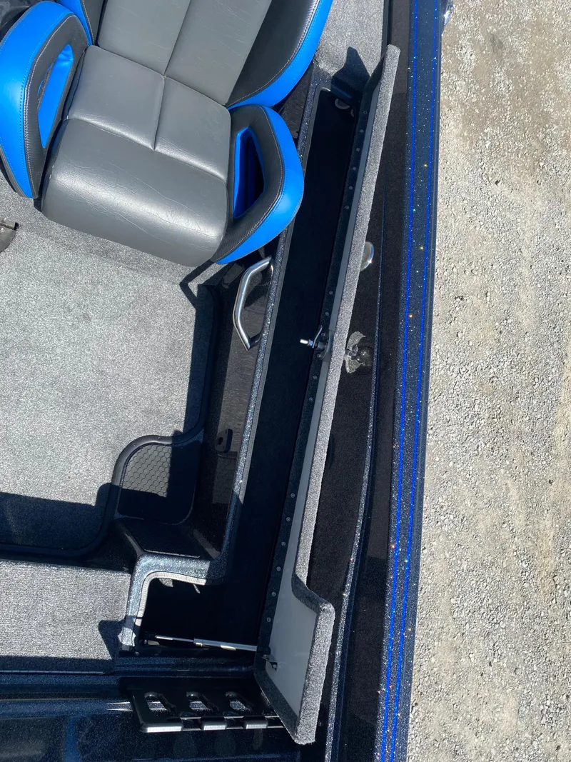 Slide: The Image of 2025 Phoenix 721 ZXL boat interior with blue and gray seating, detailed view. - 22