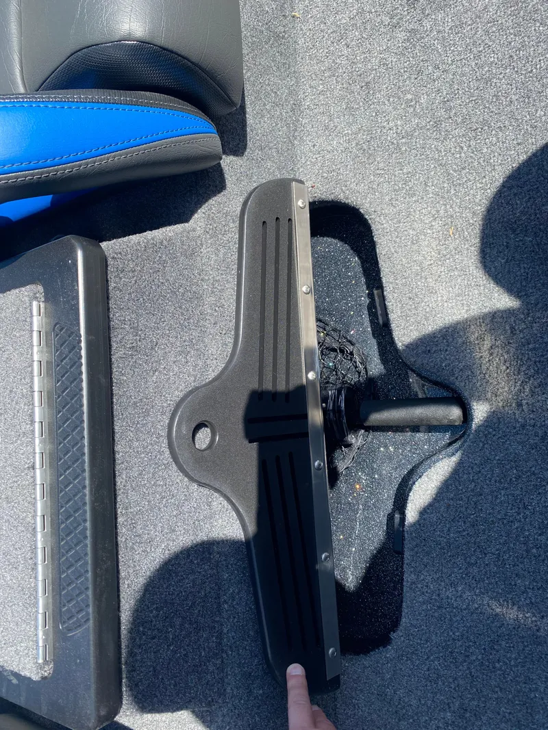 Slide: The Image of 2025 Phoenix 721 ZXL boat interior with foot pedal and blue seat detail. - 23