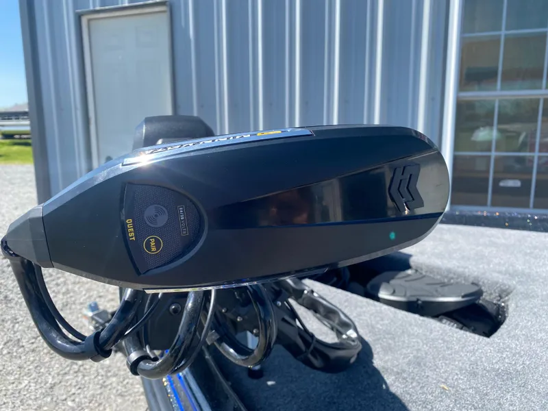 Slide: The Image of 2025 Phoenix 721 ZXL boat motor detail, close-up view with building background. - 5