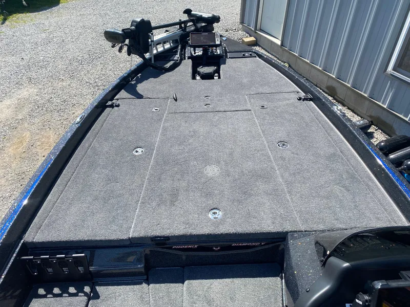 Slide: The Image of 2025 Phoenix 721 ZXL boat deck with gray carpeting and mounted equipment. - 9