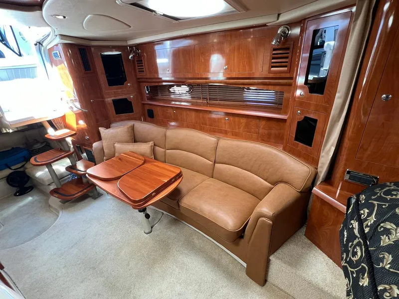 Slide: The Image of Luxurious interior of 2006 Four Winns 348 Vista yacht with leather seating and wooden cabinetry. - 10