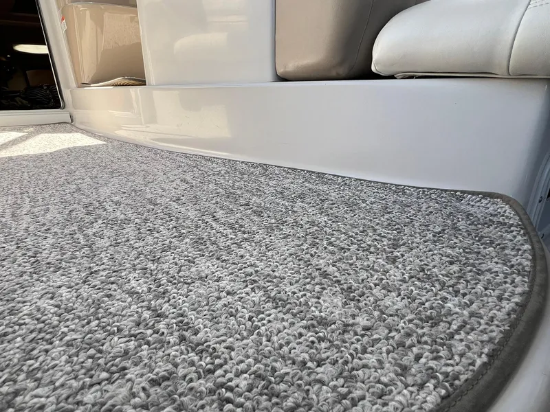 Slide: The Image of Carpeted deck area of a 2006 Four Winns 348 Vista boat. - 19