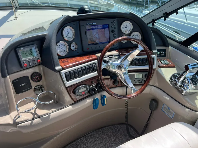 Slide: The Image of 2006 Four Winns 348 Vista boat dashboard with navigation system and controls. - 22