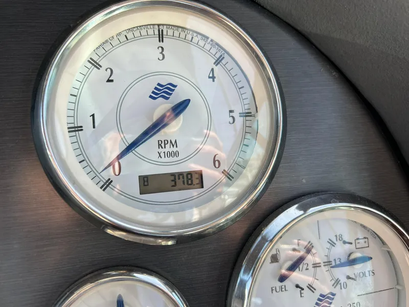 Slide: The Image of Close-up of 2006 Four Winns 348 Vista boat gauges displaying RPM and fuel levels. - 25