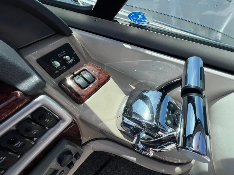 Slide: The Image of Control panel of 2006 Four Winns 348 Vista boat with chrome throttle lever. - 26
