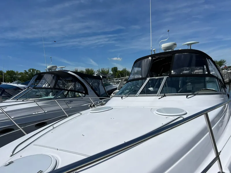 Slide: The Image of 2006 Four Winns 348 Vista yacht docked under a clear blue sky. - 30