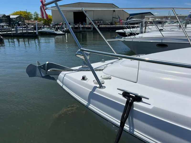 Slide: The Image of 2006 Four Winns 348 Vista yacht docked in a marina, featuring sleek white design. - 31