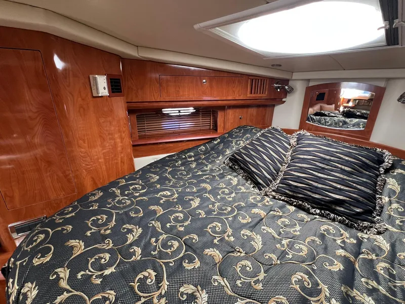 Slide: The Image of Luxurious cabin interior of 2006 Four Winns 348 Vista yacht with elegant bedding. - 7