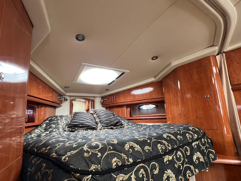 Slide: The Image of Luxurious cabin interior of 2006 Four Winns 348 Vista yacht with elegant bedding. - 8