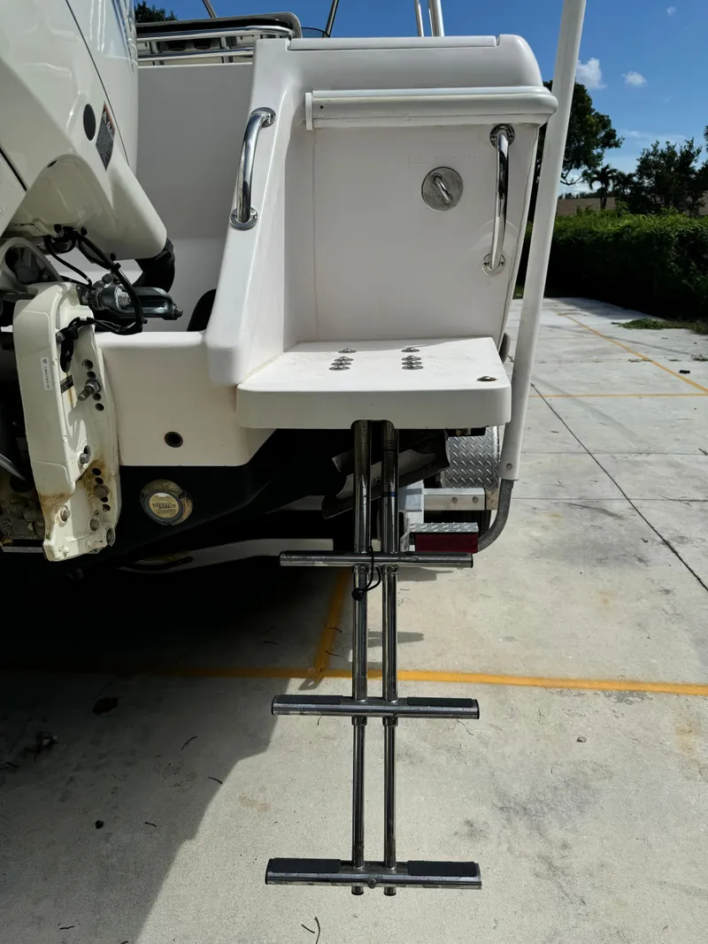 Slide: The Image of 2001 Intrepid 327 Center Console boat with extended swim ladder and platform. - 13