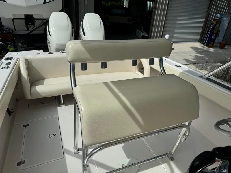Slide: The Image of 2001 Intrepid 327 Center Console boat interior with seating and dual engines. - 20