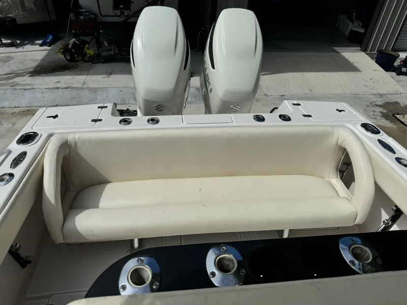 Slide: The Image of 2001 Intrepid 327 Center Console boat with dual engines and cushioned seating. - 21