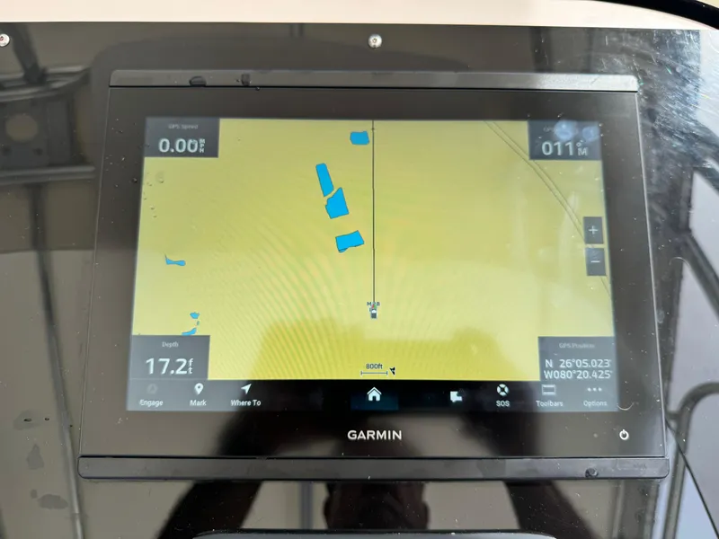 Slide: The Image of Garmin GPS display on 2001 Intrepid 327 Center Console boat dashboard. - 24
