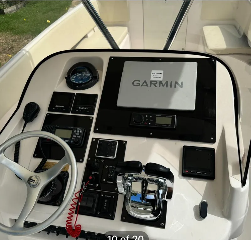 Slide: The Image of 2001 Intrepid 327 Center Console dashboard with Garmin navigation system and controls. - 6