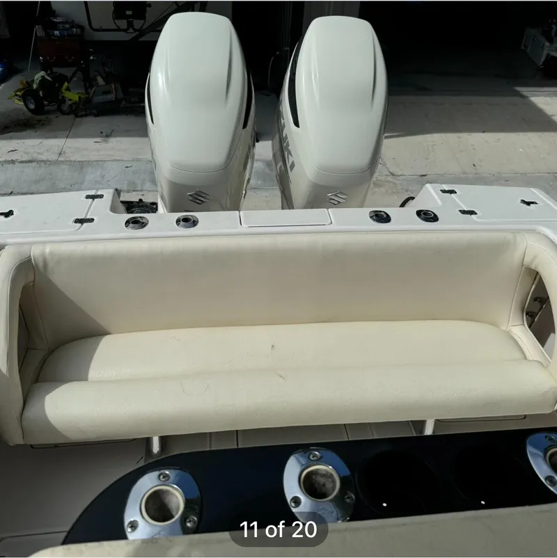 Slide: The Image of 2001 Intrepid 327 Center Console boat with dual engines and cushioned seating. - 7