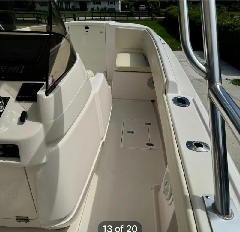 Slide: The Image of 2001 Intrepid 327 Center Console boat interior with seating and console view. - 9