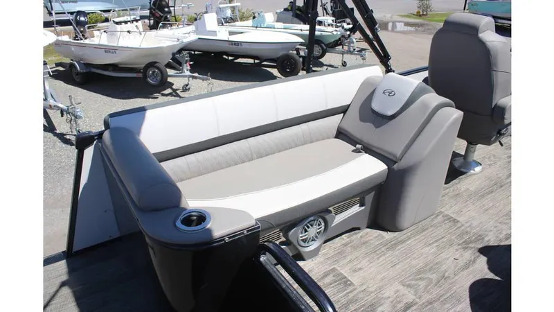 Slide: The Image of 2022 Avalon Catalina Quad Lounger boat interior with comfortable seating and cup holder. - 3