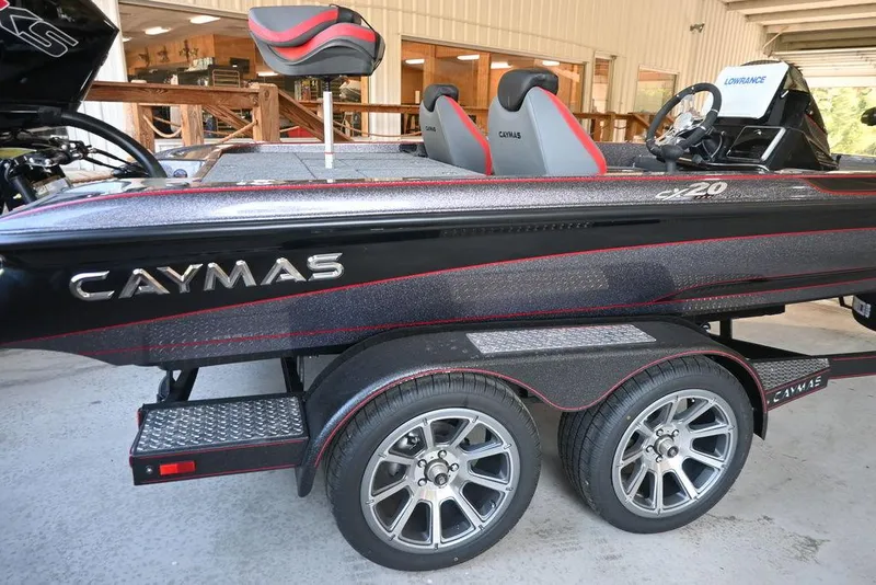 Slide: The Image of 2025 Caymas CX 20 PRO boat on trailer, featuring sleek design and dual seats. - 1