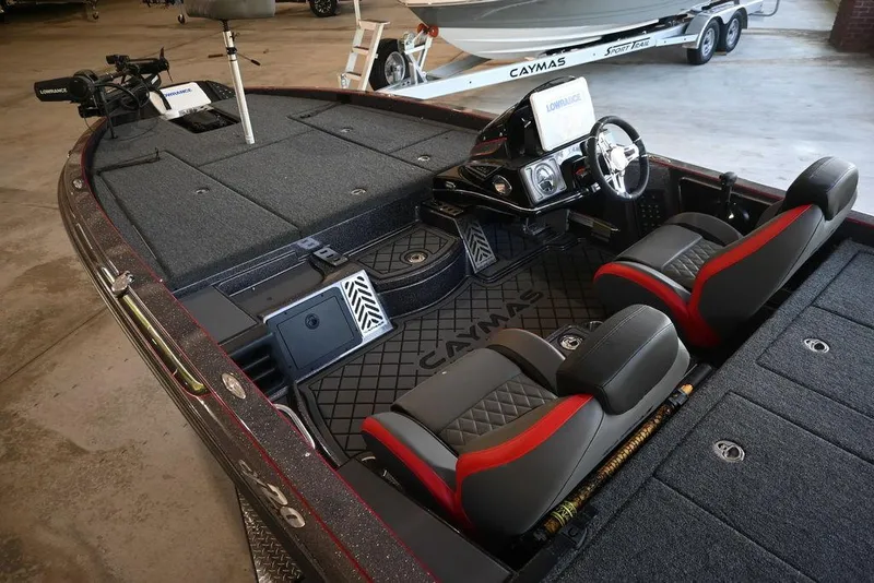 Slide: The Image of 2025 Caymas CX 20 PRO boat interior with dual seats and advanced dashboard. - 4