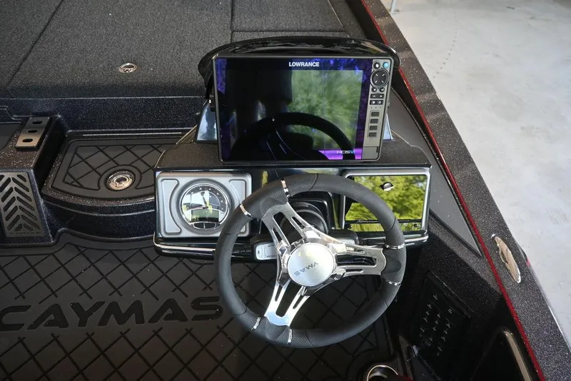 Slide: The Image of 2025 Caymas CX 20 PRO boat dashboard with steering wheel and Lowrance display. - 5