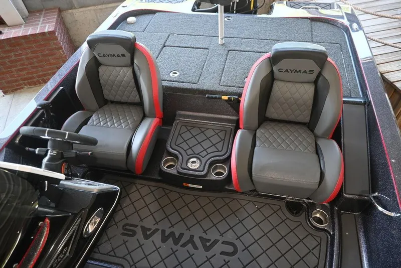 Slide: The Image of 2025 Caymas CX 20 PRO boat interior with dual seats and steering wheel. - 6