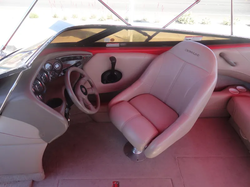 Slide: The Image of Interior of 2001 Crownline 202 BR LPX boat with steering wheel and captain's seat. - 11