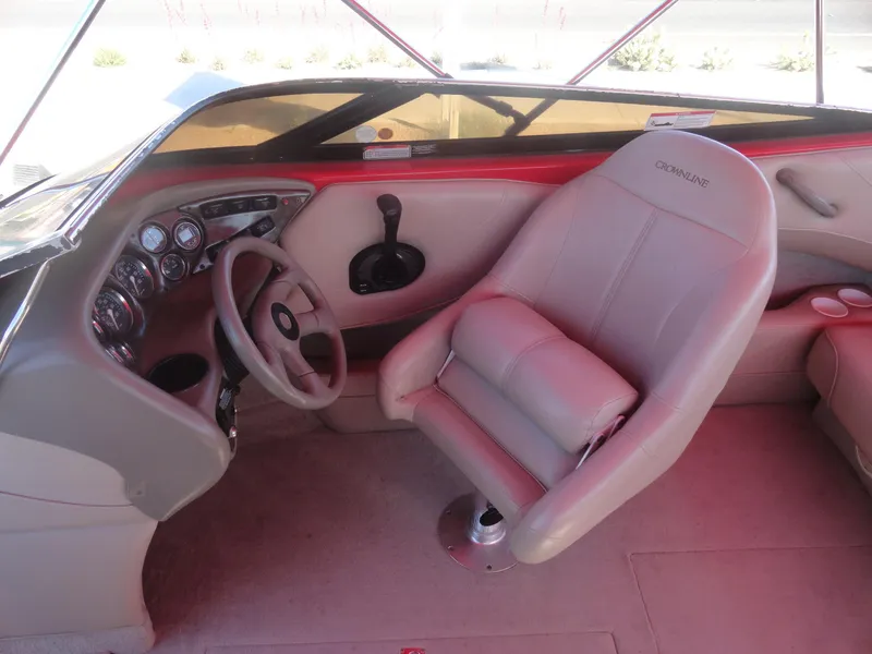 Slide: The Image of 2001 Crownline 202 BR LPX boat interior with steering wheel and captain's seat. - 12