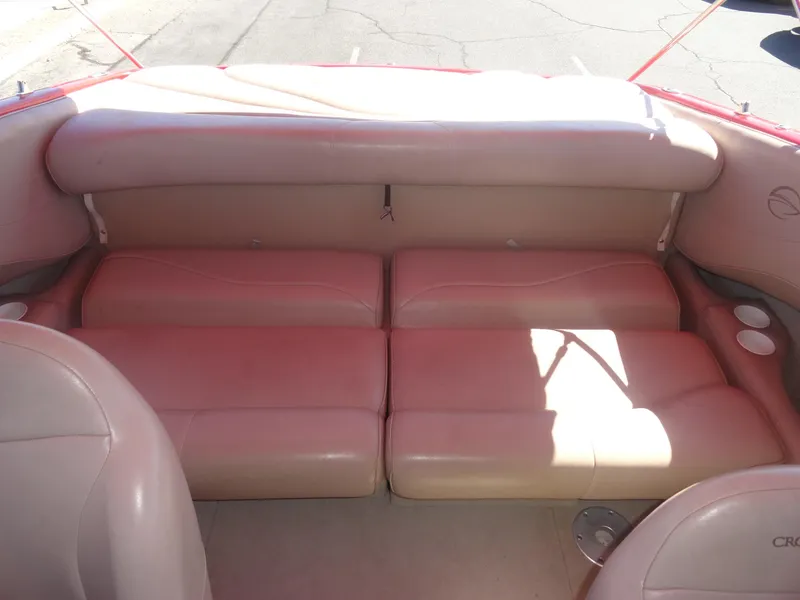 Slide: The Image of 2001 Crownline 202 BR LPX boat interior with beige seating and cup holders. - 17