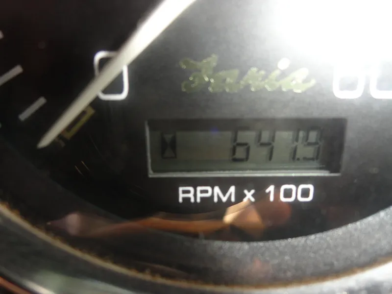 Slide: The Image of Close-up of a 2001 Crownline 202 BR LPX tachometer displaying 6419 RPM. - 9