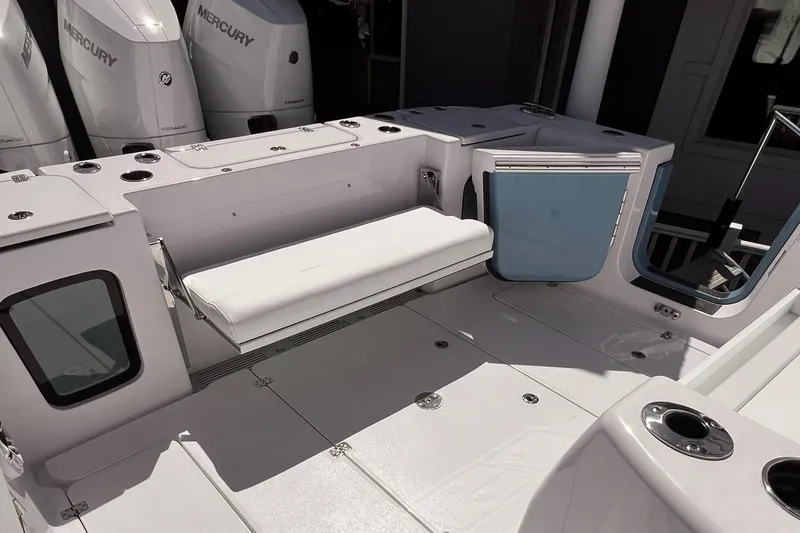 Slide: The Image of 2025 Sportsman Open 352 Center Console boat interior with seating and storage compartments. - 10