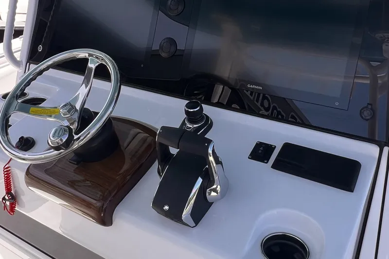 Slide: The Image of 2025 Sportsman Open 352 Center Console helm with steering wheel and controls. - 11