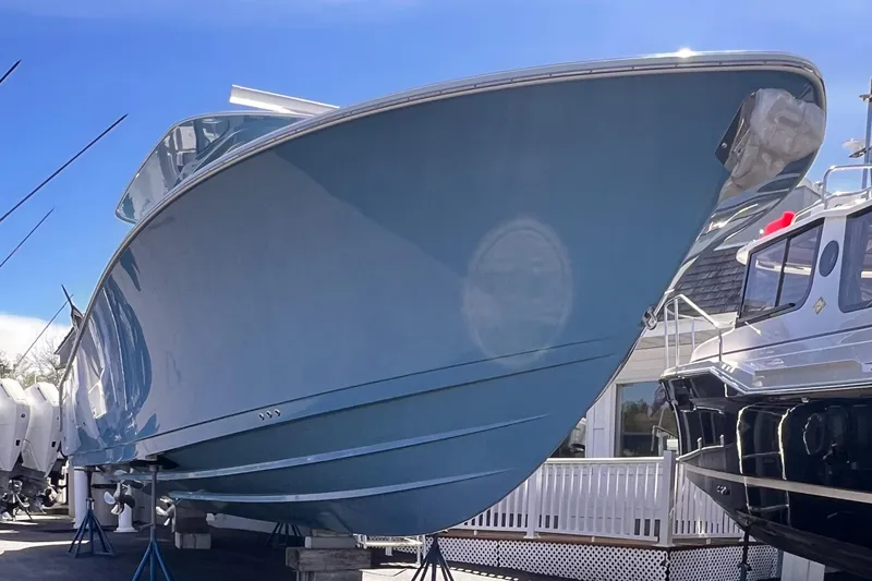 Slide: The Image of 2025 Sportsman Open 352 Center Console boat displayed outdoors. - 2