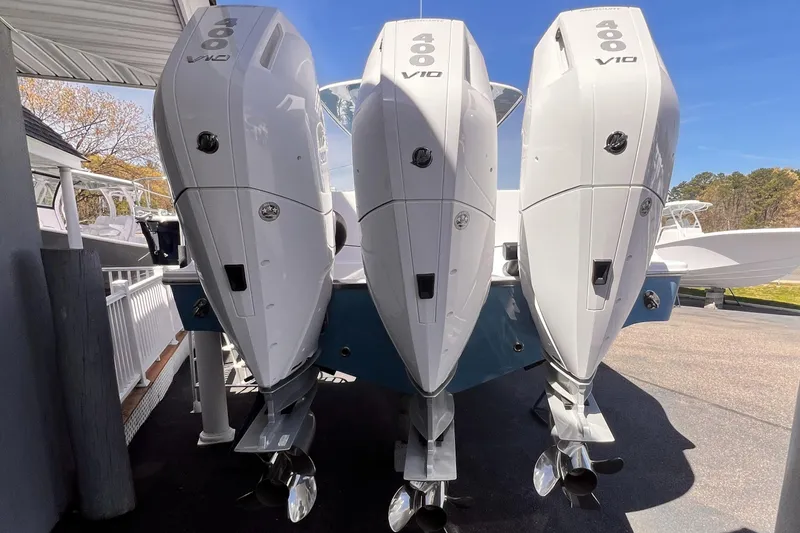 Slide: The Image of 2025 Sportsman Open 352 Center Console with triple V10 outboard engines. - 4